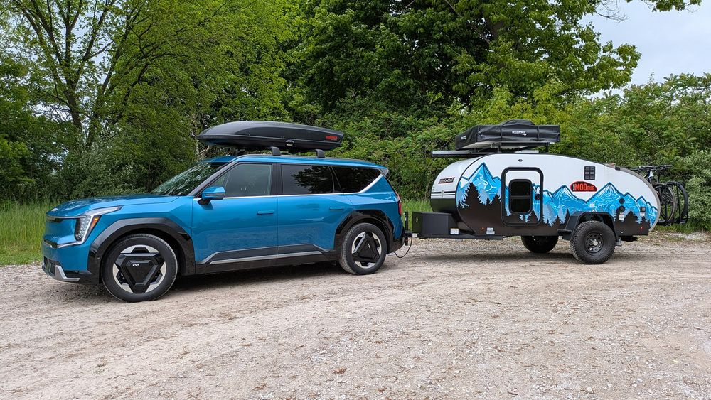 We loaded our long-term Kia EV9 Land with three big-kid toys to test how they impact range.